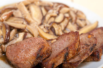 Image showing venison deer game filet and wild mushrooms