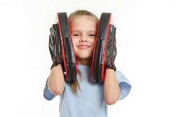 Image showing The girl put a foot to the face of boxing