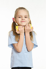Image showing The girl hugged her in the hands of a dumbbell