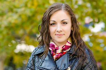 Image showing Portrait young girl on a background of autumn leaves