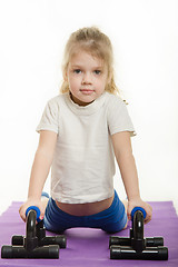 Image showing Four-year girl pressed the palm pushups