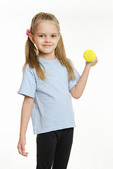 Image showing Six year old girl engaged in lifting a dumbbell exercise
