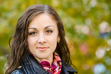 Image showing Portrait a twenty-five girls on the background of autumn leaves