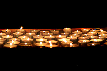 Image showing candles in the dark night