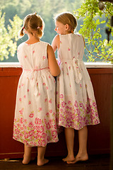 Image showing Twin girls in summer dresses