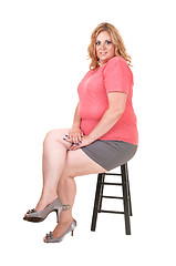 Image showing Young plus size woman sitting.