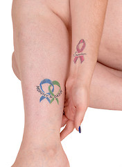 Image showing Tattoo on leg and arm.