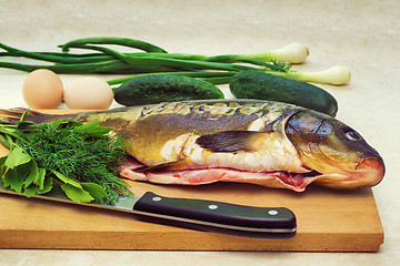 Image showing Fish and components for her preparation: vegetables, spices, oni