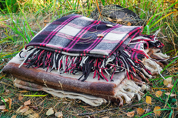 Image showing Two convenient plaid relaxing in the woods for two