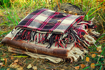 Image showing Two convenient plaid relaxing in the woods for two