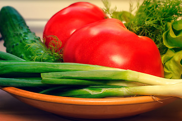 Image showing Fresh vegetables: tomatoes, cucumbers, onions, lettuce.