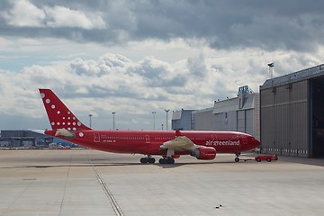 Image showing Plane going it the hangar