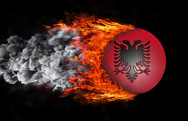 Image showing Flag with a trail of fire and smoke - Albania