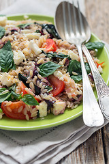 Image showing Pasta with cheese, tomatoes and basil.