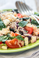 Image showing Dish with a salad of pasta orzo, basil and tomatoes.