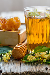 Image showing Linden tea in a glass and honey.