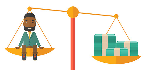 Image showing Businessman on a balance scale