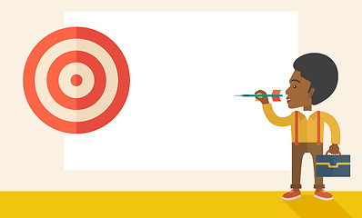 Image showing Working black man holding a target arrow 