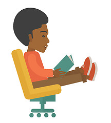 Image showing Black Man sitting with a book