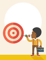 Image showing Working black man holding a target arrow 