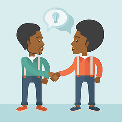Image showing Two African-american guys happily handshaking.