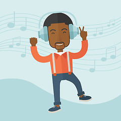 Image showing Happy young man dancing while listening to music.