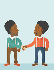 Image showing Two African-american guys happily handshaking.