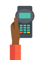 Image showing Holding credit card machine