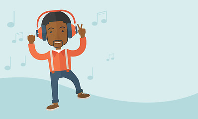 Image showing Happy young man dancing while listening to music.
