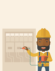 Image showing Black electrician repairing an electrical panel