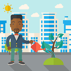 Image showing Black guy watering the plant.