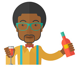 Image showing African bartender at the bar holding a drinks.