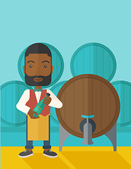 Image showing African Wine maker inspecting wine from barrel.