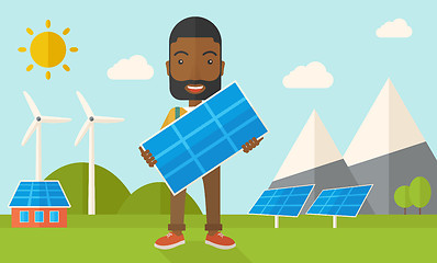 Image showing African man holding a solar panel.