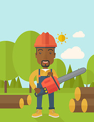 Image showing Black Lumberjack cuts a tree by chainsaw.