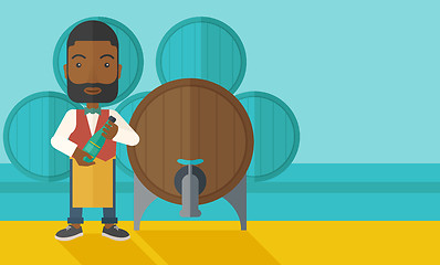 Image showing African Wine maker inspecting wine from barrel.