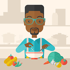 Image showing Young black guy is eating salad for lunch in the restaurant.