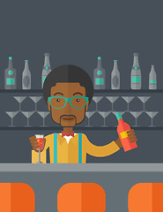 Image showing African bartender at the bar holding a drinks.