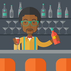 Image showing African bartender at the bar holding a drinks.