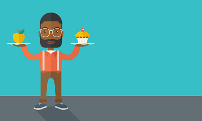 Image showing Man carries with his two hands cupcake and apple.