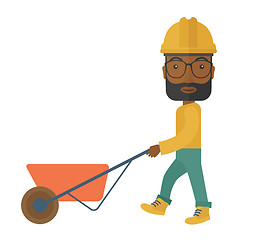 Image showing Black Gardener pushing a wheelbarrow.