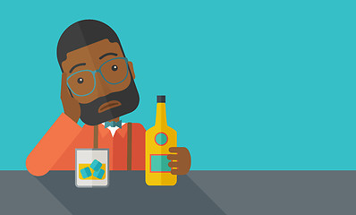 Image showing Sad african man alone in the bar drinking beer.