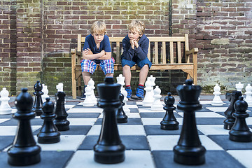 Image showing Boys playing outdoor chess