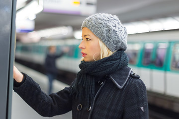 Image showing Lady buying ticket for public transport.