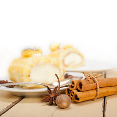 Image showing cream roll cake dessert and spices 