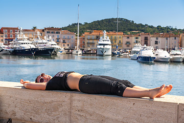 Image showing Girl and yachts on the coast of Saint Tropez, France 