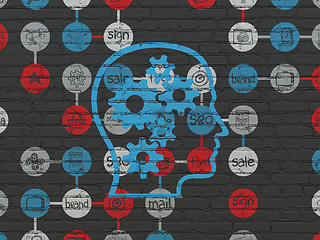 Image showing Marketing concept: Head With Gears on wall background