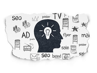 Image showing Marketing concept: Head With Light Bulb on Torn Paper background