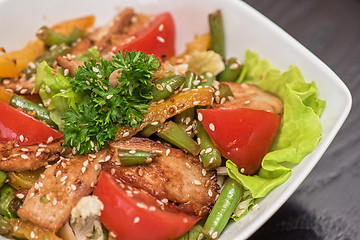 Image showing Warm salad with chicken