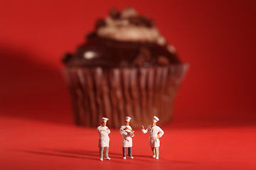 Image showing Interesting Rendition of Miniature Chefs With Cupcake